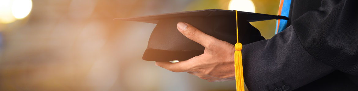 Graduation hat being held